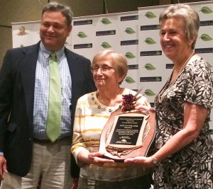 hoto: Huber (right) presents award to Wilcom with George Mayo (left), Maryland Ag in the Classroom Executive Director